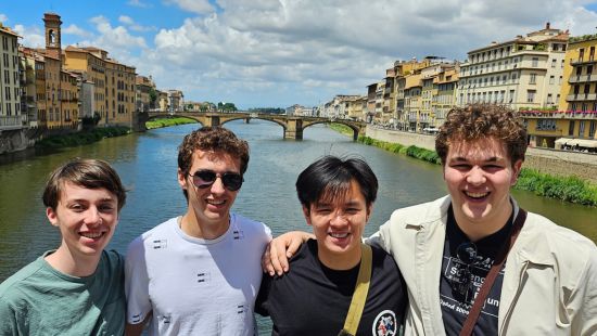 Students in front of river in Florence